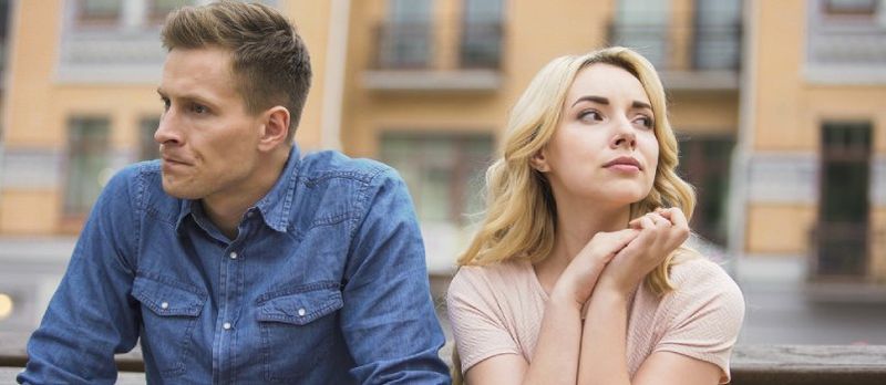 man and woman looking away 